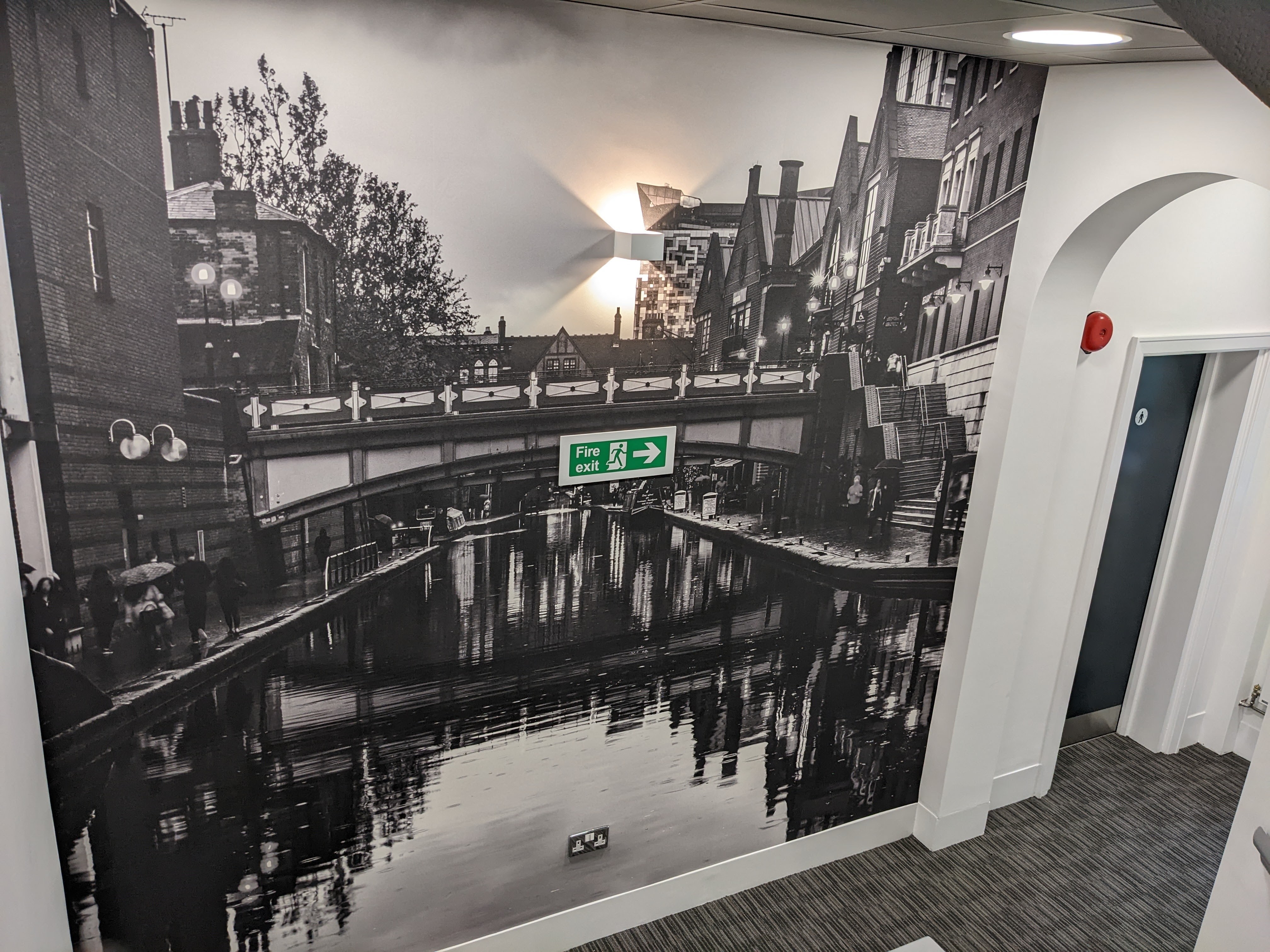 Black and white city canal stairwell mural